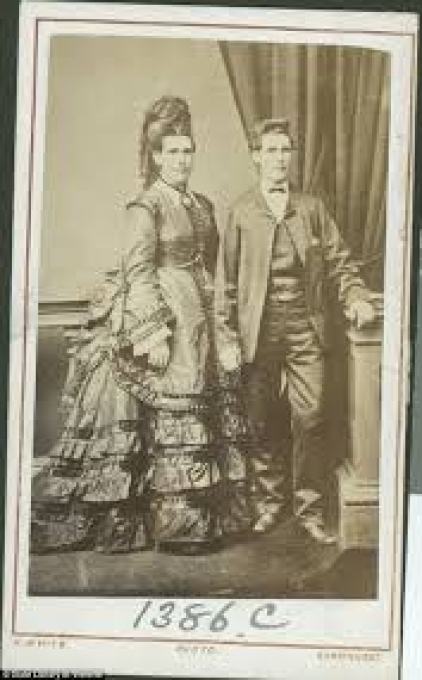 Edward photographed dressed in male and female attire. The photo was edited to make it appear that the two Edwards are standing alongside themselves.
